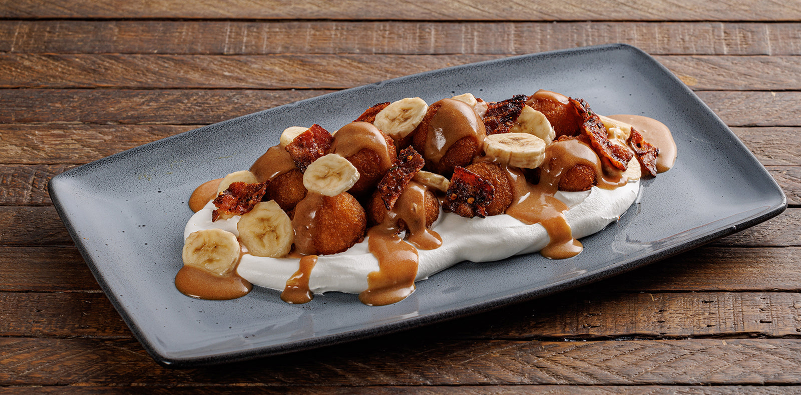 Peanut butter caramel, bacon candy, sliced bananas + whipped cream